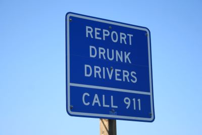 Highway sign reads: report drunk drivers - Call nine-one-one
