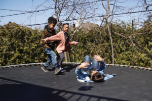 kids playing on a trampoline