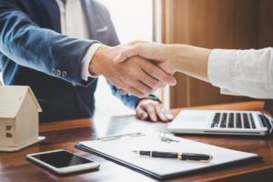lawyer shaking hands with client