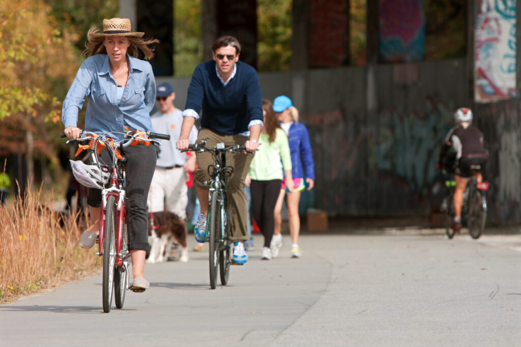 Couple Rides Bikes Along Urban Development Trail In Atlanta