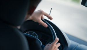 man smoking while driving