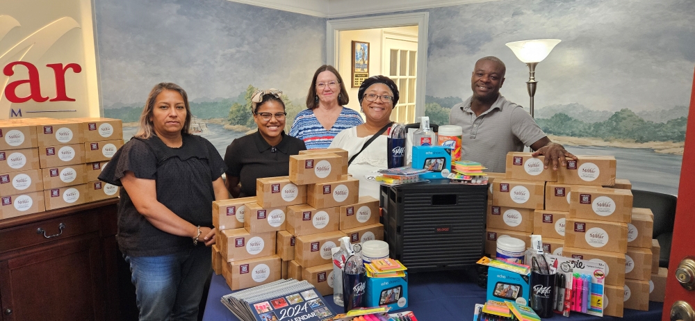 The Millar Law Firm Staff with Ms. Ebonie Durham of Harper Elementary School - 2024 grand prize winner of an Echo Show and other classroom supplies