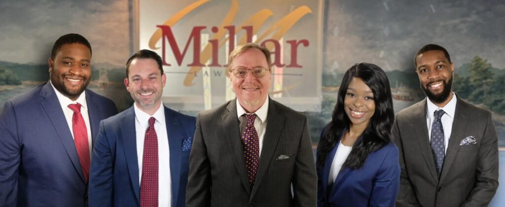 The Millar Law Firm attorneys posing for a photo